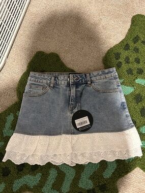 White Fox Boutique Light Blue Denim Mini Skirt with White Eyelet Lace